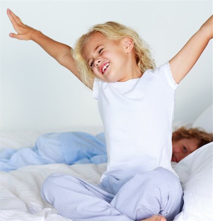 Beautiful young child stretching after sleeping Stock Photo - Budget Royalty-Free & Subscription, Code: 400-04118520