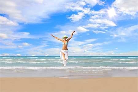 Beautiful young woman enjoying the Ionian sea in Greece Photographie de stock - Aubaine LD & Abonnement, Code: 400-04118543