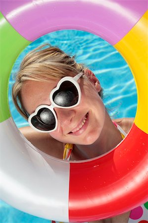 simsearch:400-04001385,k - Laughing woman with sunglasses and inflatable toy Stock Photo - Budget Royalty-Free & Subscription, Code: 400-04118990