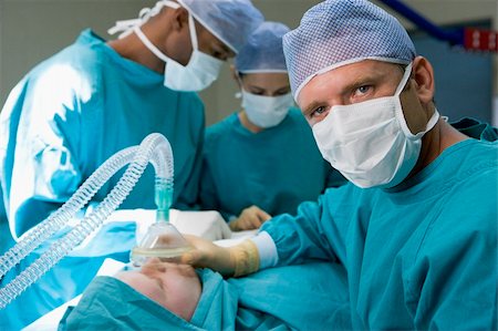 doctor in operation theater - Three Surgeons Operating On A Patient Stock Photo - Budget Royalty-Free & Subscription, Code: 400-04119004