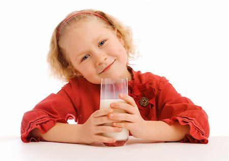 simsearch:400-04218582,k - A lovely blond preschool girl with milk Photographie de stock - Aubaine LD & Abonnement, Code: 400-04119148