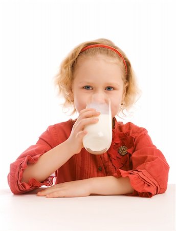 simsearch:400-04218582,k - Lovely blond preschool girl drinking milk, isolated Photographie de stock - Aubaine LD & Abonnement, Code: 400-04119149