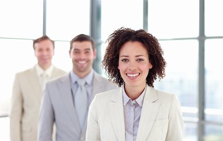 simsearch:400-04130666,k - Smiling businesswoman in a line with her colleagues Foto de stock - Royalty-Free Super Valor e Assinatura, Número: 400-04119275