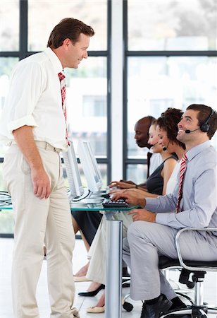 simsearch:400-04291703,k - Senior manager talking to a businessman in a call center Stock Photo - Budget Royalty-Free & Subscription, Code: 400-04119306