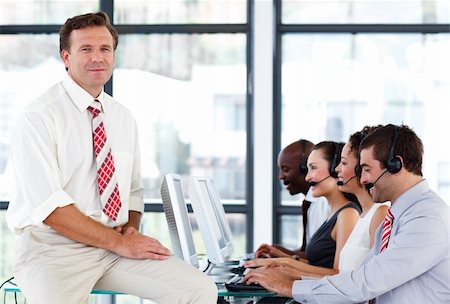 simsearch:400-04291703,k - Confident senior manager working in a call center Stock Photo - Budget Royalty-Free & Subscription, Code: 400-04119307