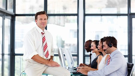simsearch:400-04291703,k - Mature manager working in a call center Stock Photo - Budget Royalty-Free & Subscription, Code: 400-04119308