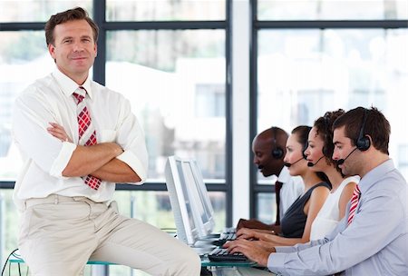 simsearch:400-04291703,k - Senior manager with crossed arms working in a call center Stock Photo - Budget Royalty-Free & Subscription, Code: 400-04119313