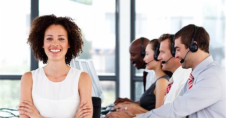 Happy female manager working in a call center with her colleagues Stock Photo - Budget Royalty-Free & Subscription, Code: 400-04119326
