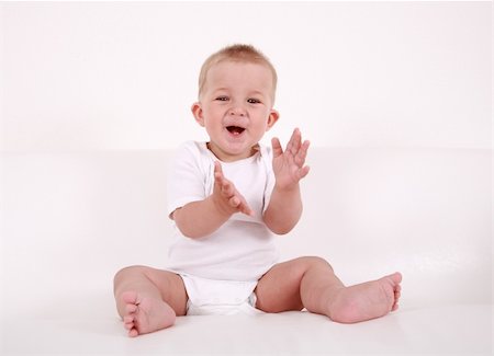 simsearch:400-04161658,k - Portrait of cute baby laughing and applauding Fotografie stock - Microstock e Abbonamento, Codice: 400-04119387