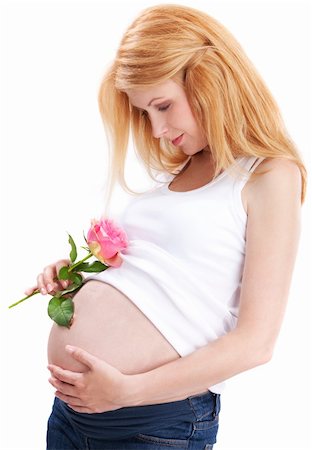 Pregnant woman standing on isolated white with rose petals Stock Photo - Budget Royalty-Free & Subscription, Code: 400-04119571