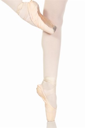 simsearch:400-04283453,k - Young caucasian ballerina girl on white background and reflective white floor showing various ballet steps and positions. Not Isolated Stockbilder - Microstock & Abonnement, Bildnummer: 400-04119686