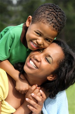 studio1one (artist) - African American mother and son having fun in park Foto de stock - Royalty-Free Super Valor e Assinatura, Número: 400-04119786