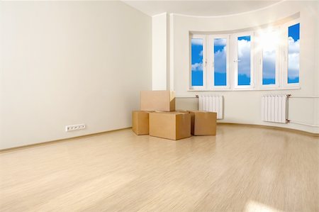 simsearch:400-04376653,k - Interior of an empty room with the boxes, shined with a sunlight Photographie de stock - Aubaine LD & Abonnement, Code: 400-04110060