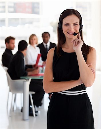 simsearch:400-04233879,k - Portrait of a friendly telephone operator working in an office environment Photographie de stock - Aubaine LD & Abonnement, Code: 400-04111006