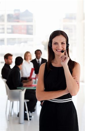 simsearch:400-08293929,k - Portrait of a friendly telephone operator working in an office environment Stock Photo - Budget Royalty-Free & Subscription, Code: 400-04111007