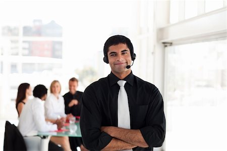 simsearch:400-05710310,k - Businessman with headset and looking at the camera Stock Photo - Budget Royalty-Free & Subscription, Code: 400-04111023