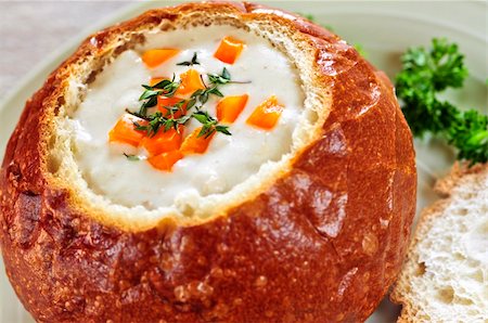 Lunch of soup served in baked round bread bowl Stock Photo - Budget Royalty-Free & Subscription, Code: 400-04111309