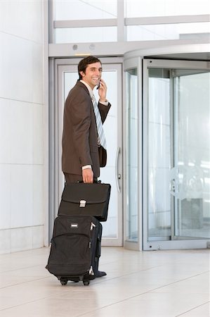 business man carrying luggage Stock Photo - Budget Royalty-Free & Subscription, Code: 400-04111400