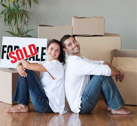 family with sold sign - Young Couple relaxing after buying house Stock Photo - Budget Royalty-Free & Subscription, Code: 400-04111762