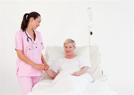 family stress at hospital - Young Nurse measuring an elderly patients Pulse Stock Photo - Budget Royalty-Free & Subscription, Code: 400-04112085