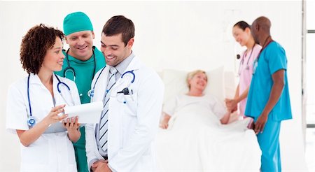 Team of Doctors with a patient Stock Photo - Budget Royalty-Free & Subscription, Code: 400-04112117