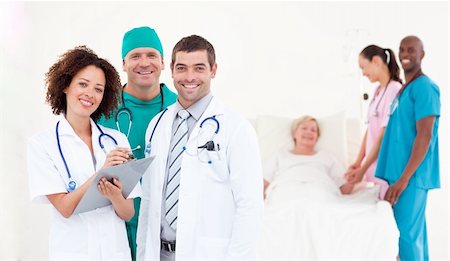Team of Doctors with a patient Stock Photo - Budget Royalty-Free & Subscription, Code: 400-04112113