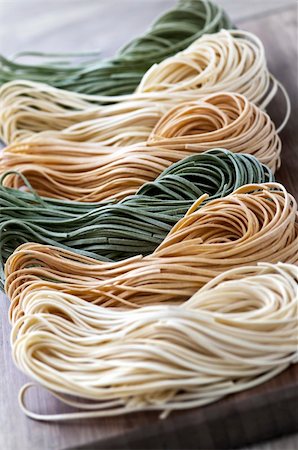 Assorted bundles of colorful raw tagliolini pasta noodles Stock Photo - Budget Royalty-Free & Subscription, Code: 400-04112144