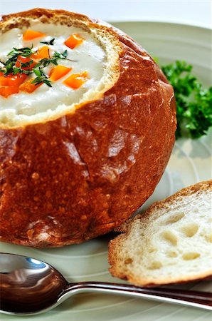 Lunch of soup served in baked round bread bowl Stock Photo - Budget Royalty-Free & Subscription, Code: 400-04112154