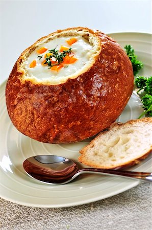 Lunch of soup served in baked round bread bowl Stock Photo - Budget Royalty-Free & Subscription, Code: 400-04112155