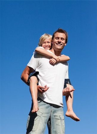 piggyback ride in the garden - Young father with his son on his back Stock Photo - Budget Royalty-Free & Subscription, Code: 400-04112358