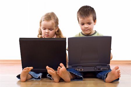 daycare on floor - Kids sitting on the floor using laptops Stock Photo - Budget Royalty-Free & Subscription, Code: 400-04112493