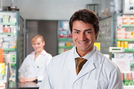 portrait of male pharmacist looking at camera and smiling Stock Photo - Budget Royalty-Free & Subscription, Code: 400-04112541