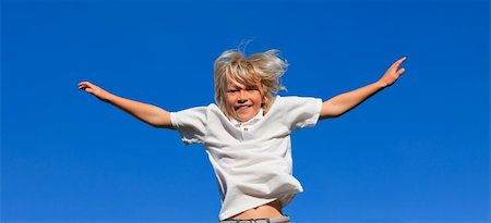 Young kid Jumping in the air Stock Photo - Budget Royalty-Free & Subscription, Code: 400-04112766