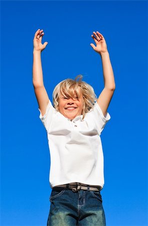 Young kid Jumping in the air Stock Photo - Budget Royalty-Free & Subscription, Code: 400-04112769