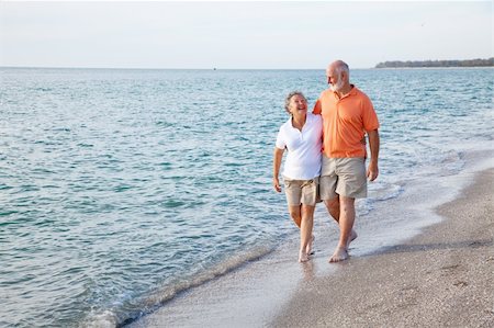 senior woman exercising by ocean - Beautiful senior couple takes a romantic stroll on a tropical beach. Stock Photo - Budget Royalty-Free & Subscription, Code: 400-04112825