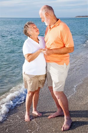 senior woman exercising by ocean - Romantic senior couple on a seaside vacation at the beach. Stock Photo - Budget Royalty-Free & Subscription, Code: 400-04112823