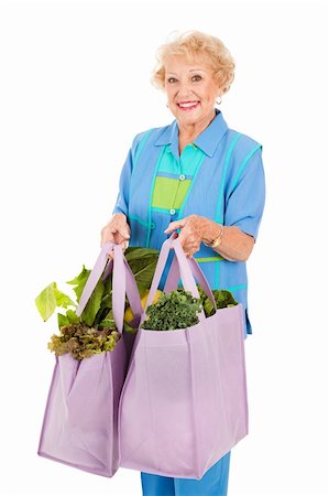 food market old people - Senior woman carrying her groceries in reusable cloth grocery bags.  Isolated on white. Stock Photo - Budget Royalty-Free & Subscription, Code: 400-04112951