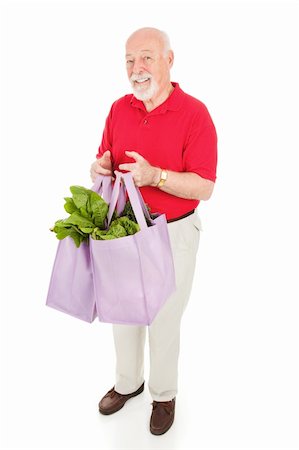 food market old people - Healthy senior man brings home groceries in reusable cloth shopping bags.  Isolated on white. Stock Photo - Budget Royalty-Free & Subscription, Code: 400-04112952