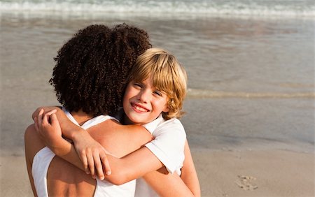 Potrait of aYoung boy hugging his mother Stock Photo - Budget Royalty-Free & Subscription, Code: 400-04113089