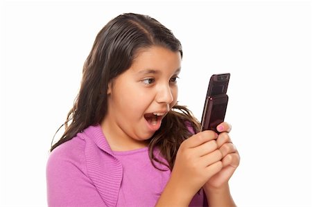 simsearch:400-04001639,k - Shocked Pretty Hispanic Girl On Cell Phone Isolated on a White Background. Foto de stock - Super Valor sin royalties y Suscripción, Código: 400-04124329