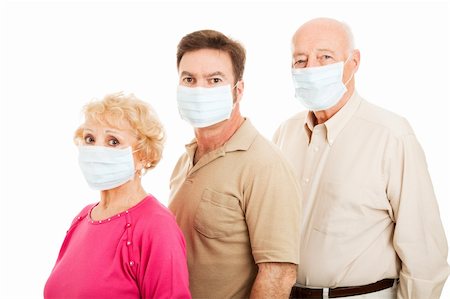 Senior couple and their adult son wearing surgical masks to protect from flu epidemic.  Isolated. Stock Photo - Budget Royalty-Free & Subscription, Code: 400-04124559