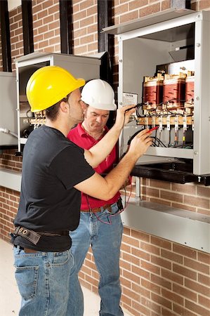 distribution center - Workers testing the voltage of an industrial power distribution center. Stock Photo - Budget Royalty-Free & Subscription, Code: 400-04124569