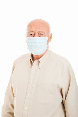 Senior man wearing a surgical mask to protect against flu epidemic.  Isolated on white. Foto de stock - Super Valor sin royalties y Suscripción, Código: 400-04124577