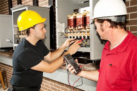distribution center - Electricians working on an industrial power distribution center.  Actual electricians and authentic accurate content. Stock Photo - Budget Royalty-Free & Subscription, Code: 400-04124570