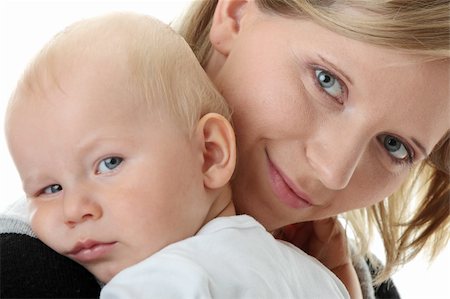 A mother and her tired cute baby boy isolated on white background Stock Photo - Budget Royalty-Free & Subscription, Code: 400-04124629