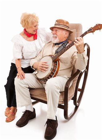 Homme Senior sérénades sa belle épouse sur le banjo. Isolé sur fond blanc. Photographie de stock - Aubaine LD & Abonnement, Code: 400-04124772