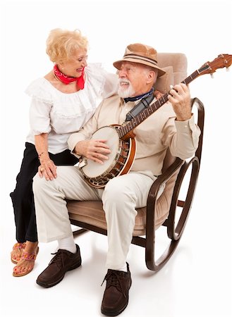 Senior man serenades his beautiful wife on the banjo.  Isolated on white. Stock Photo - Budget Royalty-Free & Subscription, Code: 400-04124772