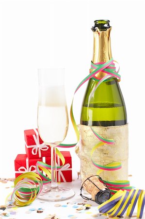 pic of drinking celebration for new year - Champagne glass ready to bring in the New Year with ribbons and confetti Stock Photo - Budget Royalty-Free & Subscription, Code: 400-04124875