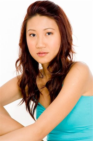 eastwestimaging (artist) - A beautiful young asian woman in a seated pose Foto de stock - Super Valor sin royalties y Suscripción, Código: 400-04125067