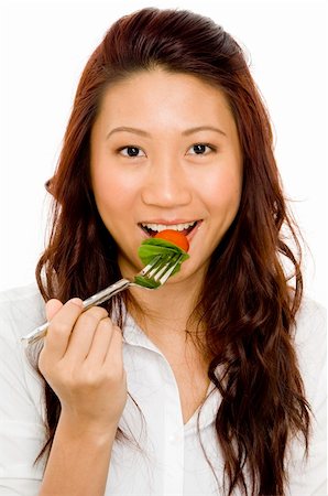 A beautiful young asian woman eating salad Stock Photo - Budget Royalty-Free & Subscription, Code: 400-04125101